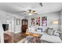 Bright and airy living room boasting a comfortable sofa, ceiling fan, and modern accents at 507 Stinson Dr # 5E, Charleston, SC 29407