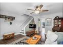 Cozy living room featuring a TV, comfortable sofa, ceiling fan, and stylish decor at 507 Stinson Dr # 5E, Charleston, SC 29407