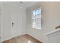 Bright entryway features a white door, hardwood floors, and a window allowing natural light at 525 Verdi Dr, Summerville, SC 29486