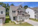Charming two-story home features a modern design, attached garage, and landscaped front yard at 525 Verdi Dr, Summerville, SC 29486
