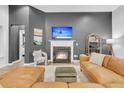 Cozy living room with a fireplace, comfortable seating, and stylish decor elements at 5408 Overland Trl, North Charleston, SC 29420