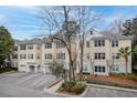 Exterior of a multi-Gathering home with garages and well-maintained landscaping at 60 Fenwick Hall Allee # 728, Johns Island, SC 29455