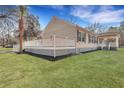 Beautiful home exterior with an expansive white wooden deck and lush green lawn at 7461 Church Hill Rd, Hollywood, SC 29449