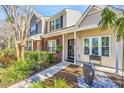 Beautiful townhome exterior showcasing manicured landscaping and a welcoming entrance at 8120 Shadow Oak Dr, North Charleston, SC 29406