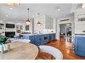 Open-concept kitchen with stainless steel appliances, marble countertops, and pendant lighting at 904 Watermelon Run, Charleston, SC 29412