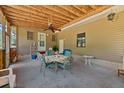 Covered porch with ceiling fan and seating, perfect for outdoor dining and relaxation at 102 Wright Ln, Goose Creek, SC 29445