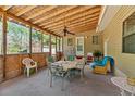 Covered porch with ceiling fan and seating, perfect for outdoor dining and relaxation at 102 Wright Ln, Goose Creek, SC 29445