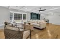 Bright living room features a large window seat, stylish furnishings, and white ceiling beams at 123 Sharon Dr, Walterboro, SC 29488