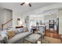Open concept living space with a view of the staircase, dining area, and well-lit kitchen at 1656 Lauda Dr, Mount Pleasant, SC 29464