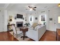Inviting living room features hardwood floors, fireplace, ceiling fan, and natural lighting at 1656 Lauda Dr, Mount Pleasant, SC 29464