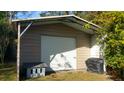 New utility shed with roll up door, offering storage and covered space at 1902 Morgan Ave, North Charleston, SC 29406