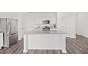 Modern kitchen with stainless steel appliances and a granite countertop island at 192 Lyra Ln, Summerville, SC 29486