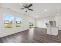 Open-concept living area with modern flooring, ceiling fan, and natural light at 192 Lyra Ln, Summerville, SC 29486