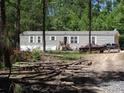 Single-Gathering home with a rustic exterior, featuring ample outdoor space and mature trees at 197 Melrose Pl, Moncks Corner, SC 29461