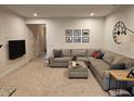 Comfortable living room featuring a large sectional sofa, TV, and neutral decor at 205 Grand Palm Ln, Summerville, SC 29485