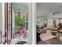 Inviting screened front porch and living room, showcasing seamless indoor-outdoor living at 2690 Park W Blvd, Mount Pleasant, SC 29466