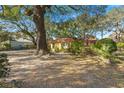 Quaint home with mature landscaping and a cozy front yard at 29 Wendy Lane, Charleston, SC 29407