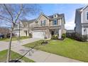 Two-story home with a two-car garage and landscaping in the front yard at 324 Saucer Rd, Summerville, SC 29486