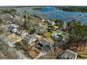 Stunning aerial view of a coastal neighborhood with waterfront properties and scenic marsh views at 5680 Barbary Coast Rd, Hollywood, SC 29449