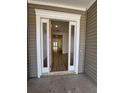 Inviting entryway with a wood-look floor, framed by white trim, leading into the bright home at 631 Marsh Cove Cir, Summerville, SC 29486