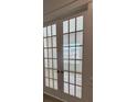 Elegant French doors with glass panes, providing natural light and a seamless transition between spaces at 631 Marsh Cove Cir, Summerville, SC 29486