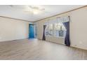 Bright and spacious living room with neutral walls, wood-look floors, and natural light at 754 Miriam Ln, Ridgeville, SC 29472