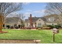 Spacious two-story home with large front lawn, mature trees, and inviting curb appeal in a lovely community at 95 Plymouth Ave, Charleston, SC 29412
