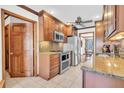 Well-equipped kitchen with stainless steel appliances, granite countertops, and wood cabinetry at 103 Night Hawk Ln, Summerville, SC 29485