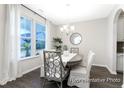 Bright dining area featuring modern furnishings and a view of the outdoors through large windows at 1044 Northern Flicker Dr # Cc3-18-2P, Ravenel, SC 29470