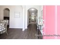 Inviting entryway featuring hardwood floors and arched doorways leading to other rooms at 1044 Northern Flicker Dr # Cc3-18-2P, Ravenel, SC 29470
