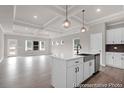 Kitchen showcasing stainless steel dishwasher, ample cabinetry and an island with a sink at 1056 Marsh Harrier Dr # Cc3-15-6P, Ravenel, SC 29470