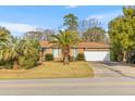 Well-maintained brick house with mature landscaping, featuring a two-car garage at 1060 Yeamans Hall Rd, Hanahan, SC 29410