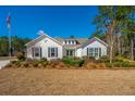 Inviting front yard with green lawn and beautiful home in a desirable community at 225 Camber Rd, Huger, SC 29450