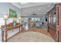 Comfortable living room featuring hardwood floors, wainscoting, and an open floor plan at 225 Camber Rd, Huger, SC 29450