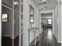 Open entryway featuring hardwood floors, hanging light fixtures, and a console table at 265 Celestial Blvd, Summerville, SC 29486