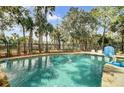 A refreshing pool with a lush, fenced-in landscape creates a private oasis for swimming and leisure at 2745 Oak Manor Dr, Mount Pleasant, SC 29466