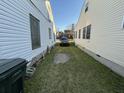 View of a narrow driveway running between two houses, ending with a dark SUV at 28 Gordon St, Charleston, SC 29403