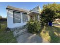 Modest home featuring simple architecture, side yard and traditional window design at 28 Gordon St, Charleston, SC 29403