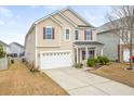 Charming two-story home with a well-maintained yard and attached two-car garage at 406 Butterfly Bush Dr, Goose Creek, SC 29445