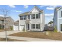 Charming two-story home with a two-car garage, manicured lawn, and traditional design in a suburban neighborhood at 464 Fox Sparrow Ct, Summerville, SC 29486