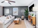 Modern living room featuring a comfortable couch, stylish decor, and a cozy rug on light floors at 5034 Pittman St, North Charleston, SC 29405