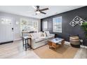 Inviting living room with a neutral sofa, accent wall, and view of the entryway and desk at 5034 Pittman St, North Charleston, SC 29405