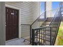 Exterior landing and stairs of a condo building with unit 14206 door at 700 Daniel Ellis Dr # 14206, Charleston, SC 29412