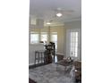 Inviting living area with dark wood flooring, bright light, and ceiling fan offers a great place to relax at 700 Daniel Ellis Dr # 6107, Charleston, SC 29412