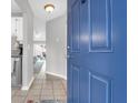 Open blue front door that leads to a living room with a ceiling fan and rug at 851 Sandlake Dr # F, Mount Pleasant, SC 29464