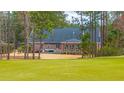 The backyard of this brick home features a large stone patio perfect for outdoor relaxation and entertainment at 105 Pine Valley Dr, Summerville, SC 29483