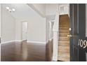 Inviting entryway featuring dark hardwood floors, staircase, and modern lighting at 109 Arbor Oaks Dr, Summerville, SC 29485