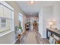 Bright foyer with hardwood floors, large windows, and an open view of the living spaces at 117 Tyger St, Summerville, SC 29485