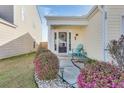 Charming front entrance with a cozy seating area, decorative plants, and a welcoming atmosphere at 117 Tyger St, Summerville, SC 29485