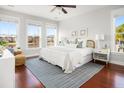 Serene main bedroom with abundant natural light, hardwood floors, and elegant, comfortable furnishings at 158 Sandshell Dr, Charleston, SC 29492
